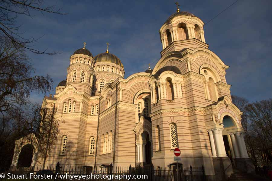 The Nativity of Christ Cathedral (Kristus Piedzimsanas pareizticīgo katedrale), a Neo-Byzantine Russian Orthodox church seen under a blue sky in Riga, Latvia.