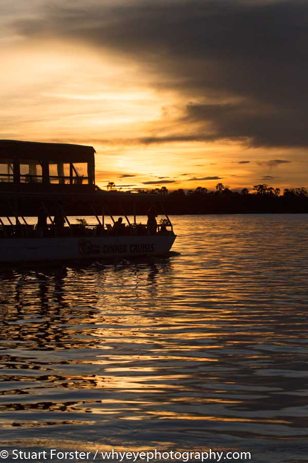 A boat during a sunset cruise on the Zambezi River that offered opportunities to photograph birds and wildlife.