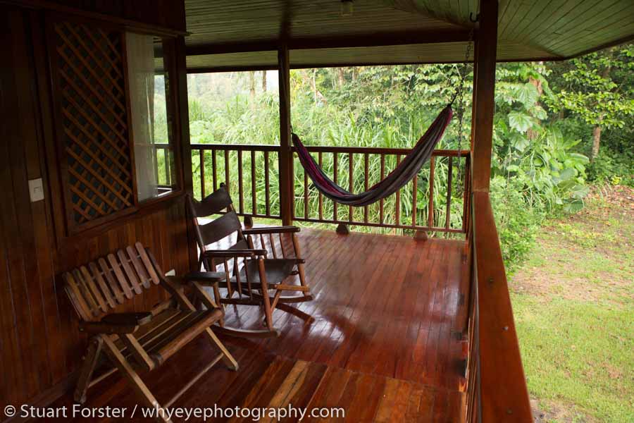 Hammock and chairs outside of a room at Selva Verde Lodge an eco-lodge in Costa Rica.