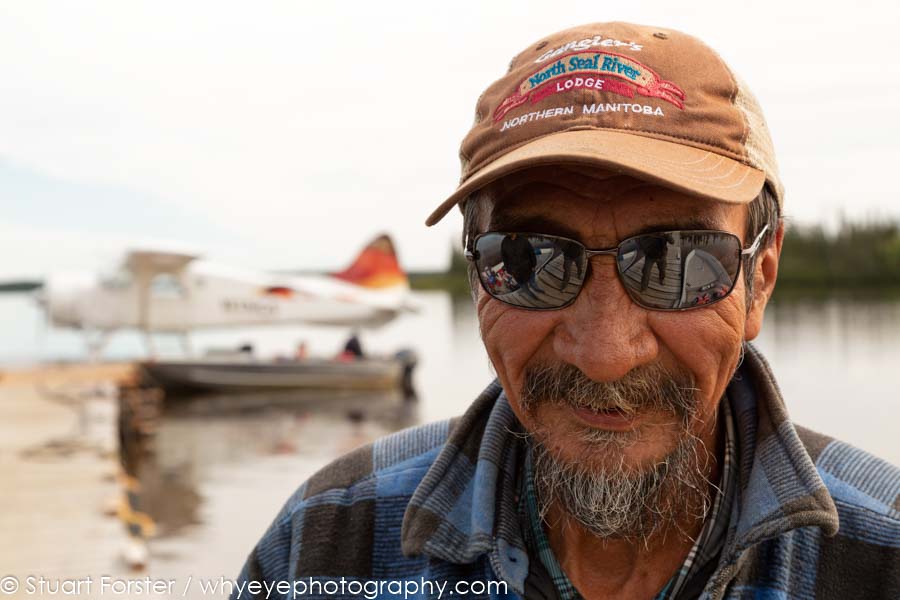 Singadore, a fishing guide, on the jetty on Lake Egenolf at North Seal River Lodge in northern Manitoba, Canada