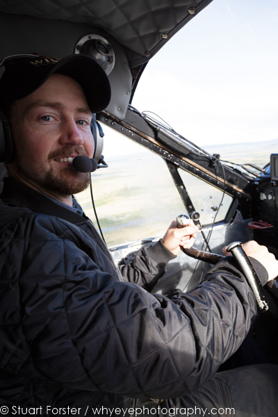 Colin Knight, the pilot of a de Havilland Canada DHC-2 Beaver, flying in Manitoba, Canada.