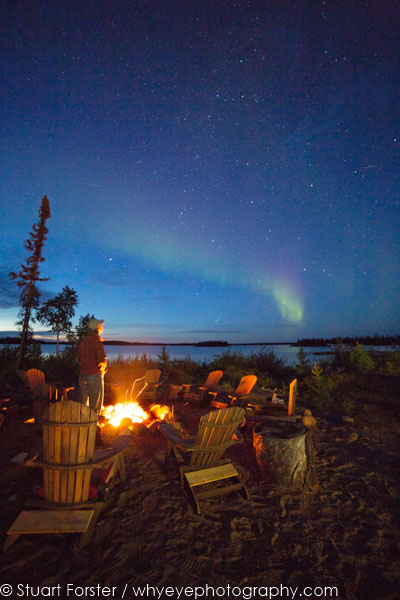The northern lights and stars in the night sky of Northern Manitoba.