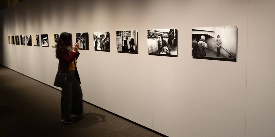 A visitor views Wessing's photographs.