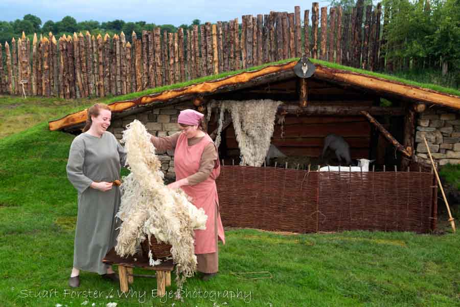 Women in Viking era costumes at Kynren's Viking Village near the set of the outdoor show.