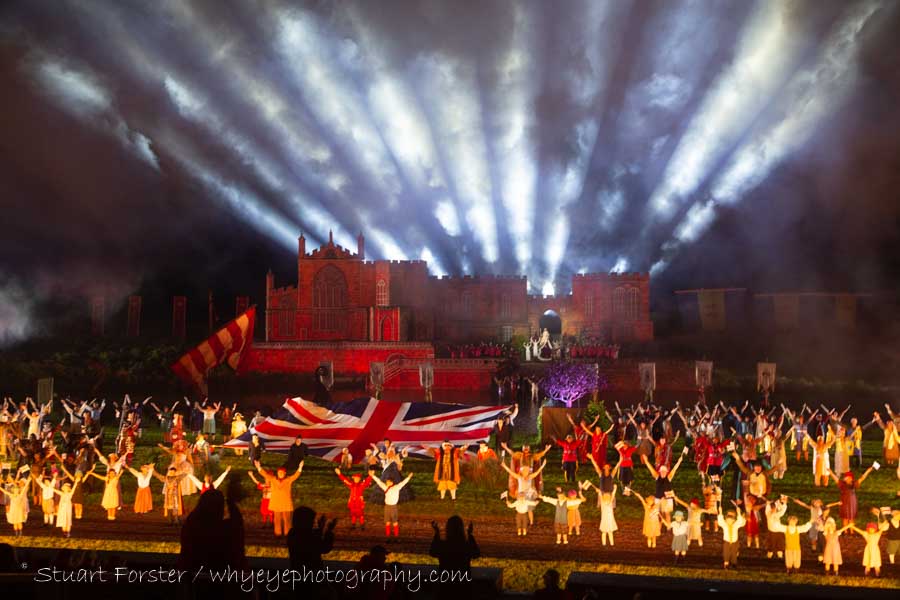 A union jack is paraded by the full cast beneath a light show at the finale of of the outdoor spectacle and captured by Stuart Forster during Photography of Kynren at Bishop Auckland.