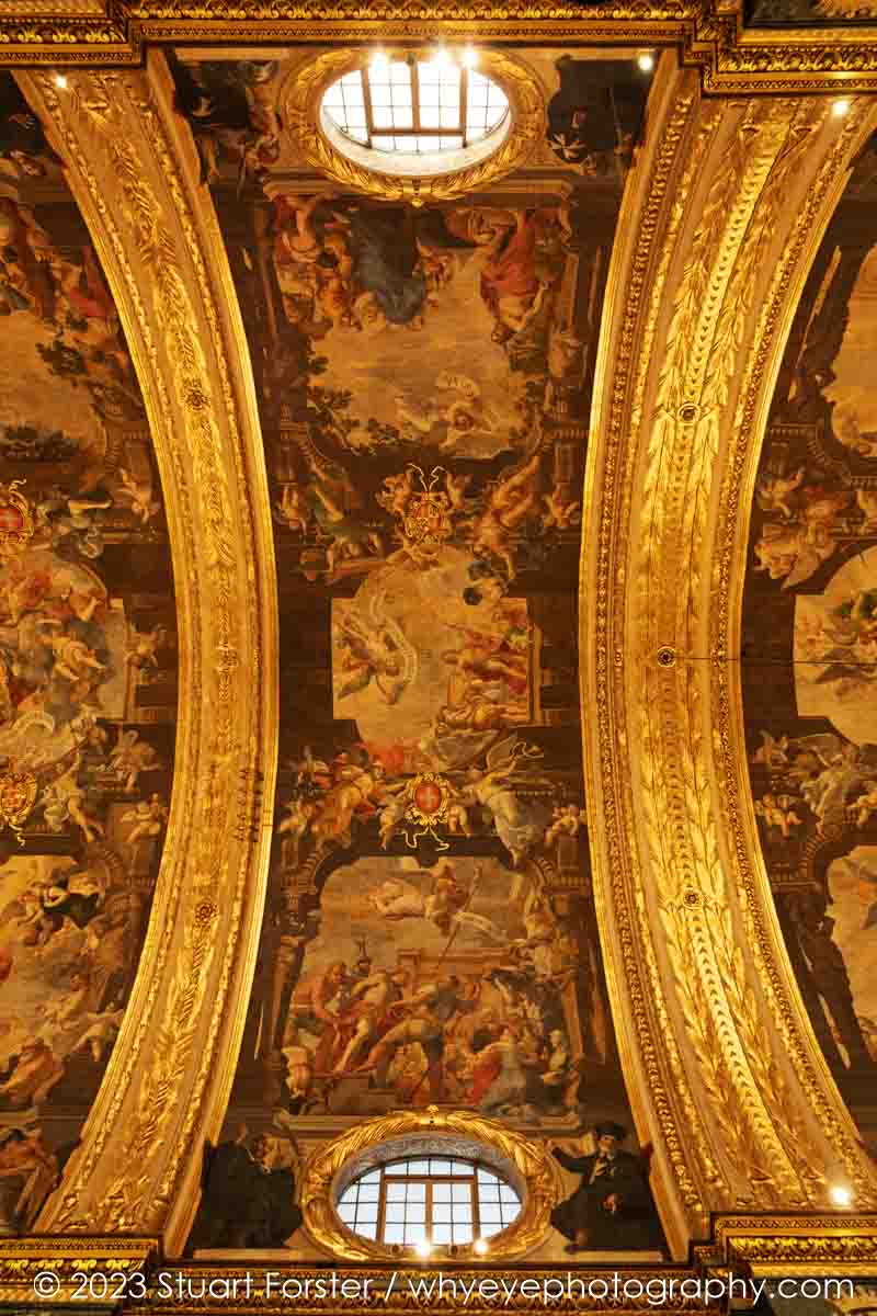 Religious scenes and golden arches on the ornate ceiling of the Co-Cathedral of St. John in Valletta, Malta.